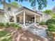Backyard featuring covered patio with outdoor furniture, set in a lush, landscaped garden, perfect for outdoor enjoyment at 2501 Richardson Dr, Charlotte, NC 28211