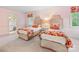 Charming bedroom features twin beds with patterned bedding and a window that provides natural light at 2501 Richardson Dr, Charlotte, NC 28211