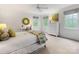 Bedroom showcasing a bed with decorative pillows, desk, dresser, and natural light, creating an inviting and functional space at 2501 Richardson Dr, Charlotte, NC 28211