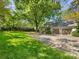 Well-maintained home featuring lush lawn and a spacious driveway, showcasing curb appeal and inviting entry at 2501 Richardson Dr, Charlotte, NC 28211