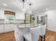 Gourmet kitchen featuring a center island with a cooktop, pendant lighting, and ample counter space at 2501 Richardson Dr, Charlotte, NC 28211