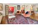 Elegant living room featuring classic décor, hardwood floors, and dining room access at 2501 Richardson Dr, Charlotte, NC 28211