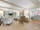 Inviting living room with exposed beam ceilings, stylish decor, and an open layout to the kitchen at 2501 Richardson Dr, Charlotte, NC 28211