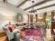 Cozy living room featuring a decorative chandelier, traditional style, and plenty of seating at 2501 Richardson Dr, Charlotte, NC 28211