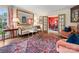 Stylish living room with a large mirror, decorative rug, and view to dining room at 2501 Richardson Dr, Charlotte, NC 28211