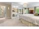 Primary bedroom showcasing mirrored wardrobe, soft carpet, and abundant natural light from the windows at 2501 Richardson Dr, Charlotte, NC 28211