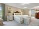 Large primary bedroom featuring a stylish bed with patterned accents, bedside tables, and views of the bright exterior at 2501 Richardson Dr, Charlotte, NC 28211
