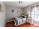 Cozy bedroom with a twin bed, wood floors, and a bright window at 2551 Glenwood St, Kannapolis, NC 28083