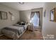 Comfortable bedroom features a twin bed and neutral decor at 2551 Glenwood St, Kannapolis, NC 28083