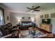 Cozy living room with plush seating, a ceiling fan, and stylish decor at 2551 Glenwood St, Kannapolis, NC 28083
