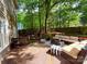Expansive backyard offering multiple seating areas, a fire pit, and a spacious deck for entertaining at 2600 Kirkholm Dr, Matthews, NC 28105