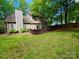 Large backyard with a deck, manicured lawn and plenty of space for outdoor activities and entertainment at 2600 Kirkholm Dr, Matthews, NC 28105