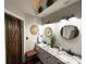 Stylish bathroom with double sinks, granite countertops, and unique wicker decor accents at 2600 Kirkholm Dr, Matthews, NC 28105