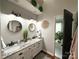 Elegant bathroom featuring dual sinks, granite countertops, and stylish lighting fixtures at 2600 Kirkholm Dr, Matthews, NC 28105