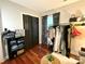 Organized closet with dark bi-fold doors, clothing rack, and shelves, offering ample storage space at 2600 Kirkholm Dr, Matthews, NC 28105