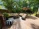 Spacious deck with sectional seating, an umbrella table and stylish striped poufs, perfect for outdoor relaxation at 2600 Kirkholm Dr, Matthews, NC 28105