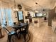 Open kitchen showcases pendant lighting, stainless appliances and seamless flow into the breakfast nook at 2600 Kirkholm Dr, Matthews, NC 28105