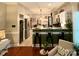 Eat-in kitchen with granite countertops, barstool seating, stainless steel appliances and bright lighting at 2600 Kirkholm Dr, Matthews, NC 28105