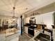 Modern kitchen features granite countertops, stainless steel appliances, and a stylish light fixture at 2600 Kirkholm Dr, Matthews, NC 28105