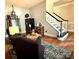 Cozy living room featuring hardwood floors, a decorative rug, and stylish furnishings at 2600 Kirkholm Dr, Matthews, NC 28105