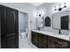 Elegant bathroom with double vanity, granite countertop, and modern fixtures at 2694 Woodcrest Sw Dr, Concord, NC 28027