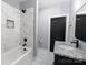 Bathroom with tiled walls, shower and tub combination, and granite countertop at 2694 Woodcrest Sw Dr, Concord, NC 28027
