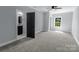 Bright bedroom featuring a ceiling fan, neutral carpet, and an ensuite bathroom at 2694 Woodcrest Sw Dr, Concord, NC 28027