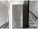 Hallway featuring luxury vinyl plank floors and access to a staircase at 2694 Woodcrest Sw Dr, Concord, NC 28027