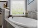 Close up of a corner soaking tub in bathroom at 270 Conifer Way, Shelby, NC 28150