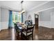 Formal dining room with elegant chandelier and large windows at 270 Conifer Way, Shelby, NC 28150