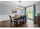 An elegant dining room featuring a modern chandelier and large windows at 270 Conifer Way, Shelby, NC 28150