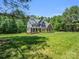 Beautiful two-story home with a manicured lawn, lush landscaping, and inviting front porch at 270 Conifer Way, Shelby, NC 28150