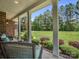 Relax on this spacious front porch, with plenty of seating and beautiful views of the mature trees at 270 Conifer Way, Shelby, NC 28150