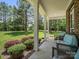 Relaxing front porch with comfortable seating and beautifully landscaped surroundings at 270 Conifer Way, Shelby, NC 28150
