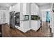 Stylish kitchen featuring white cabinets, stainless appliances, and modern lighting at 270 Conifer Way, Shelby, NC 28150