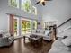 Bright living room featuring hardwood floors, large windows, and comfortable seating at 270 Conifer Way, Shelby, NC 28150
