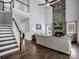 Cozy living room with a stone fireplace and a staircase at 270 Conifer Way, Shelby, NC 28150