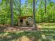 Backyard shot features a charming wooden outbuilding or shed at 270 Conifer Way, Shelby, NC 28150
