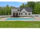 Back of the house with an in-ground pool and a well-maintained yard at 270 Worthington Dr, Mt Ulla, NC 28125