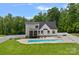 Back of the house with an in-ground pool and a well-maintained yard at 270 Worthington Dr, Mt Ulla, NC 28125