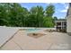 Spacious backyard with a swimming pool, a white fence, and stone landscaping at 270 Worthington Dr, Mt Ulla, NC 28125