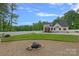 Wide backyard featuring a fire pit, a well-maintained lawn, and an in-ground swimming pool at 270 Worthington Dr, Mt Ulla, NC 28125