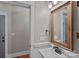Modern bathroom with framed mirror, white sink, and updated fixtures at 270 Worthington Dr, Mt Ulla, NC 28125