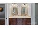Bathroom featuring double sinks with granite countertops and framed mirrors at 270 Worthington Dr, Mt Ulla, NC 28125