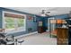 Blue bedroom with a large window, ceiling fan, dresser and a drum set at 270 Worthington Dr, Mt Ulla, NC 28125