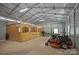 Garage interior with stalls, machinery, and concrete floor at 270 Worthington Dr, Mt Ulla, NC 28125