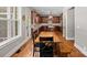 Well-appointed kitchen features dark wood cabinetry, stainless appliances, and an adjacent rustic dining table at 270 Worthington Dr, Mt Ulla, NC 28125