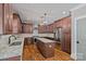 Gourmet kitchen boasts granite countertops, stainless steel appliances, and dark wood cabinets at 270 Worthington Dr, Mt Ulla, NC 28125