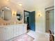 Bright bathroom with double vanity, ample counter space, and shower at 3040 Valencia Ter, Charlotte, NC 28211