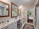 Bathroom with double sink vanity and access to bedroom at 3040 Valencia Ter, Charlotte, NC 28211